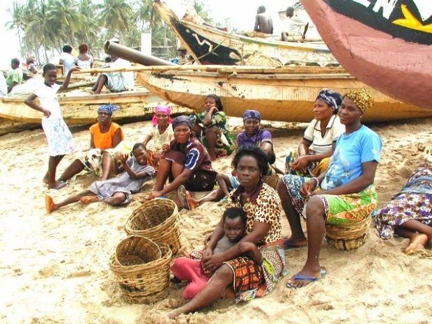 Women waiting patiently at the shore for the catch